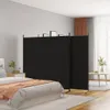 A bedroom scene with a black room divider set up behind a bed. Anteprima dell’immagine prodotto