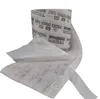 A roll of white tape with black text and markings, partially unrolled to show its layered structure. Produktbild-Vorschau
