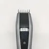 A close-up, top-down view of a beard trimmer on a white background. Náhled obrázku produktu