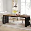 A dining room scene with a wooden table and chairs. Produktbild-Vorschau
