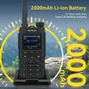 A walkie-talkie is shown in a charging dock with a background of mountains and trees. Yellow circular graphics and text highlight the product's features. Produktbild-Vorschau