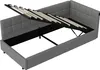 A grey upholstered bed frame with the mattress support mechanism lifted to reveal storage space underneath. Náhľad obrázku produktu