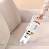 Weißer und oranger Handstaubsauger, der zum Reinigen eines hellen Sofas verwendet wird Produktbild-Vorschau