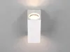 A white, rectangular outdoor wall light is mounted on a light gray wall. Produktbild-Vorschau
