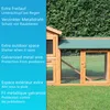 A wooden animal hutch with a green roof, set against a green hedge and grass. Produktbild-Vorschau