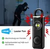 A split image showing a burglar in a dark room on the left, and a personal alarm device with features highlighted on the right. Produktbild-Vorschau