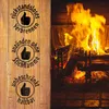 Three circular stamps with thumbs-up icons and German text are on a wooden background to the left of a burning fireplace. Produktbild-Vorschau