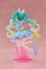 A figurine of Hatsune Miku in a fairy tale outfit, posed dynamically on a pink heart-shaped stand against a light pink background. Produktbild-Vorschau