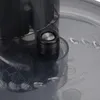A close-up view of a food processor attachment with visible markings and text. Produktbild-Vorschau