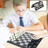 Two children playing chess at a table. Produktbild-Vorschau