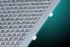 A close-up shot of a metallic filter with a diamond-shaped pattern, framed by a silver border. Produktbild-Vorschau