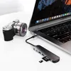 A camera is connected to a laptop via a USB-C hub. Produktbild-Vorschau