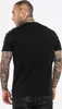 A man wearing a black t-shirt with white tape on the shoulders, shown from the back. Produktbild-Vorschau
