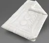 A white duvet is laid out on a plain gray background. Produktbild-Vorschau