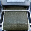 A close-up view of a filter roll on a machine. Produktbild-Vorschau
