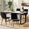 A dining set with a table and four chairs in a dining room setting.