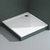 A white square shower tray with a drain is shown in a bathroom corner, with dark gray tiled walls and light gray tiled floor. Produktbild-Vorschau