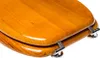 A close-up, angled view of a wooden toilet seat and lid. Produktbild-Vorschau