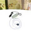 A small green USB air pump with a black cable and a clear tube with an air stone. Podgląd zdjęcia produktu