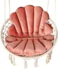 A close-up studio shot of a pink seashell-shaped cushion for a hanging chair. Produktbild-Vorschau