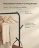 A close-up view of a black metal coat rack with wooden hangers and clothing items, highlighting its features with text overlays. Produktbild-Vorschau