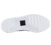 The sole of a white Puma shoe is shown against a white background. Voir les images du produit