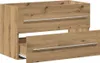 A wooden cabinet with two drawers, one of which is partially open. Produktbild-Vorschau
