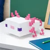 A pixelated axolotl light sits on a white surface next to a blue notebook and a green pencil. Anteprima dell’immagine prodotto