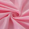 A close-up, abstract view of soft, pink fabric, likely a pillowcase or blanket, with folds and curves creating a swirling pattern. Produktbild-Vorschau