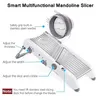 A white multifunctional mandoline slicer with labels pointing out its features. Produktbild-Vorschau