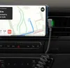 A smartphone displaying a navigation app is mounted on a car's air vent, connected to a charging cable. Anteprima dell’immagine prodotto