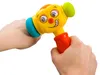 Two hands holding a colorful toy hammer with a cartoon face. Voir les images du produit