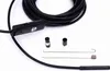 A black endoscope inspection camera with accessories laid out on a white background. Náhled obrázku produktu