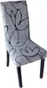 A single chair with a patterned slipcover, isolated on a white background. Produktbild-Vorschau