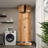 A laundry room with a washing machine and a tall wooden cabinet. Anteprima dell’immagine prodotto