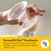 A hand holding a breast pump part with text overlay. Podgląd zdjęcia produktu