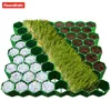 A product shot of hexagonal grid panels filled with gravel, grass, and soil. Produktbild-Vorschau