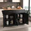 A black kitchen island with a wooden countertop is shown in a well-lit room with a large window overlooking a cityscape. Voir les images du produit