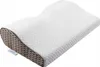 A white orthopedic memory foam pillow with a contoured shape and a textured side. Náhled obrázku produktu
