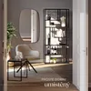 A modern living room scene with a chair, shelf, and mirror, enhanced with text overlay. Náhled obrázku produktu
