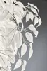A close-up of white artificial leaves on branches against a gray background. Produktbild-Vorschau