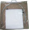 A product in its packaging, showing a white material and a metal frame. Produktbild-Vorschau