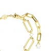 A close-up shot of a gold-colored bracelet with chain links and a crystal charm. Produktbild-Vorschau