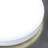 A close-up, angled view of a white, circular LED ceiling light fixture with a subtle glow emanating from its edge. Náhľad obrázku produktu