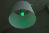 A green LED light bulb inside a white lampshade. Náhled obrázku produktu