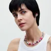 A close-up portrait of a woman wearing a Pandora necklace. Náhled obrázku produktu
