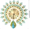A peacock-shaped wall clock with intricate feather details and a decorative peacock at the bottom. Náhled obrázku produktu