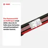 A close-up of a luggage strap with a handwritten name tag attached, next to a text box describing the product's function. Náhled obrázku produktu