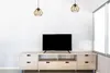 A modern living room setup with a TV stand and a television. Náhľad obrázku produktu
