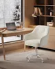 A cozy home office setup with a desk, chair, and window view of a snowy landscape. Produktbild-Vorschau